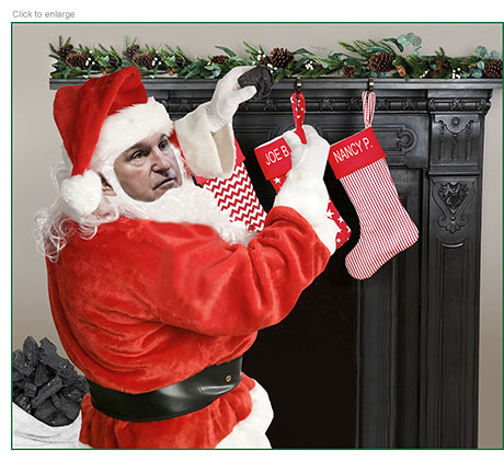 Joe Manchin as Santa Claus places a lump of coal in Joe Biden's sticking hung above a fireplace next to Nancy Pelosi's.