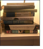 Stack of books on night table